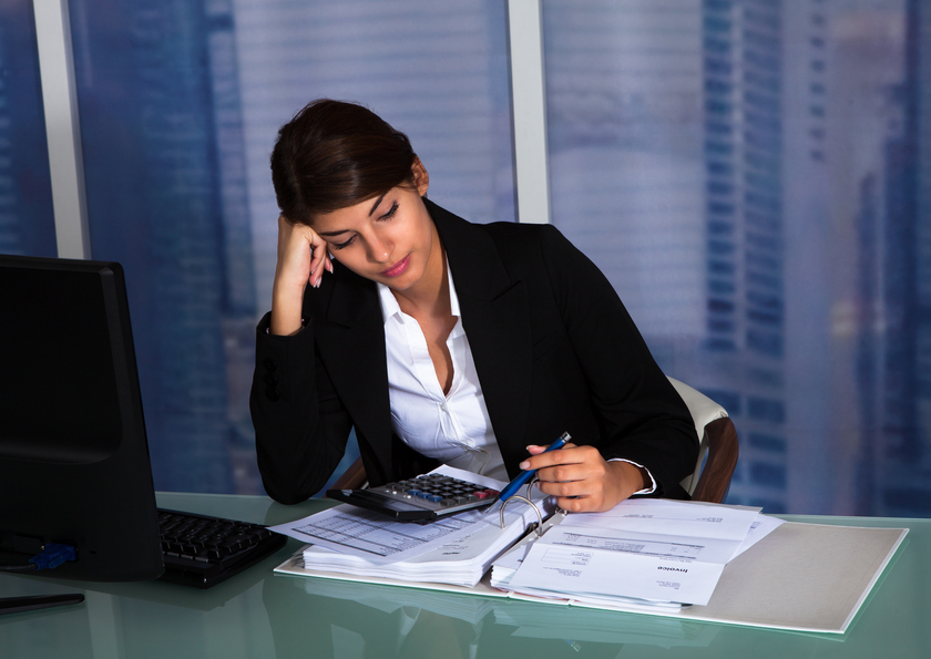 Stressed Businesswoman Working In Office