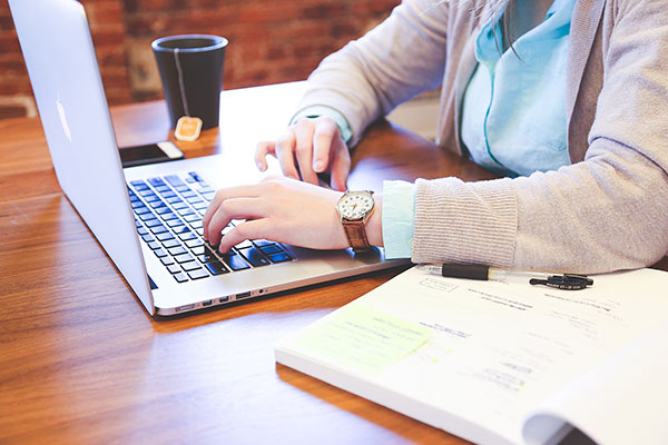 student-woman-laptop-book